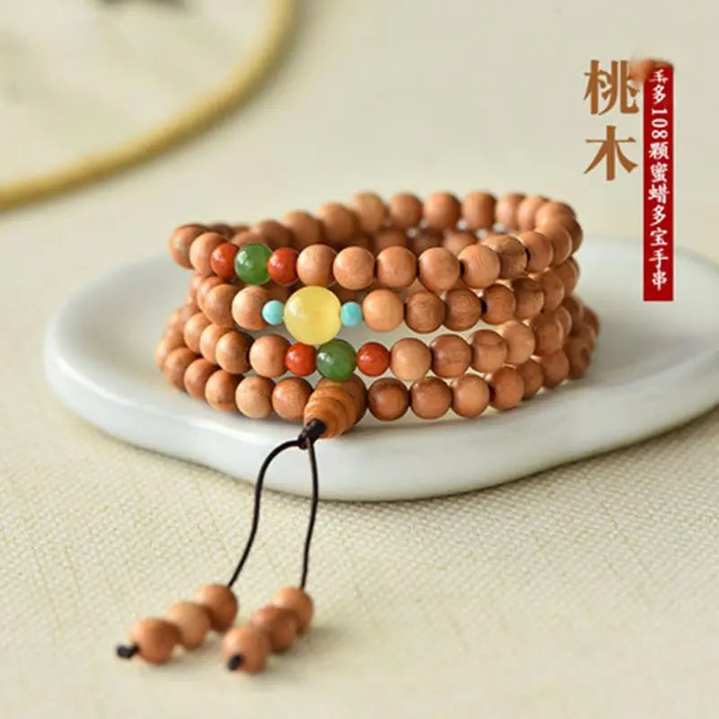 Peach wood multi-circle bracelet, beeswax lucky beads