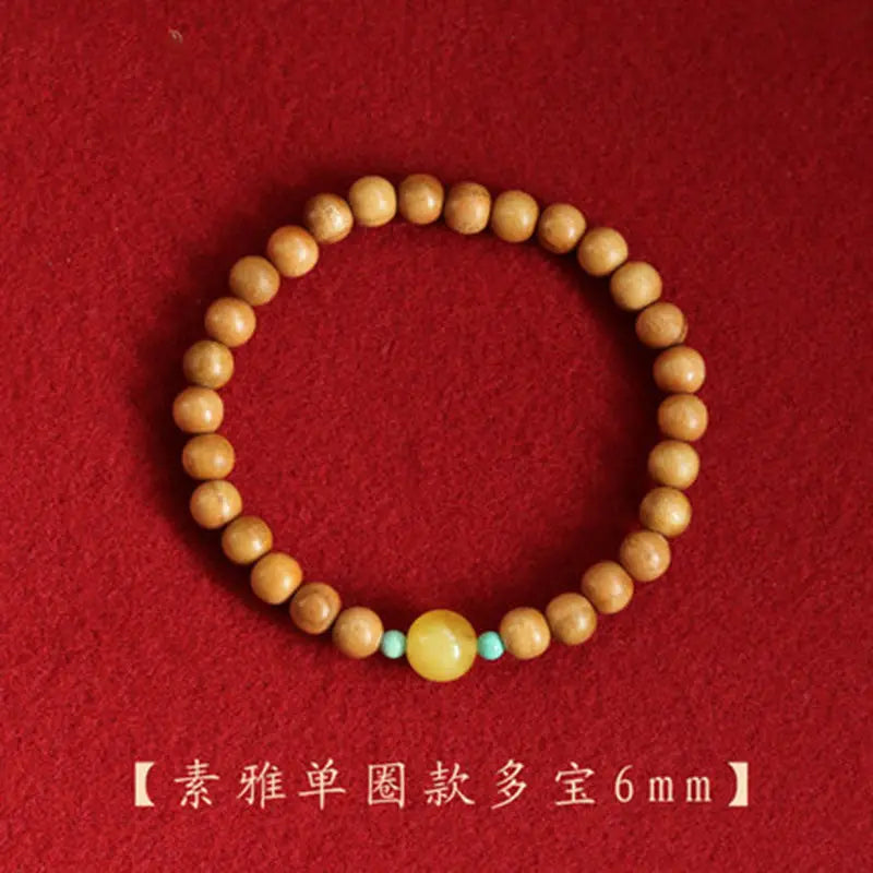 Peach wood multi-circle bracelet, beeswax lucky beads