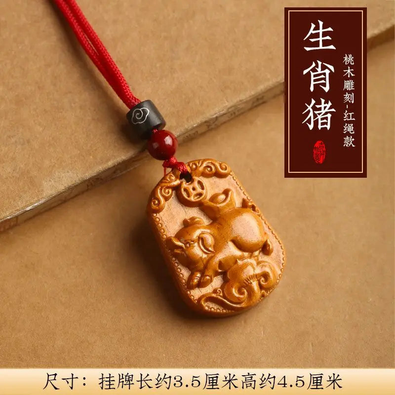 Peach wood zodiac carved pendant