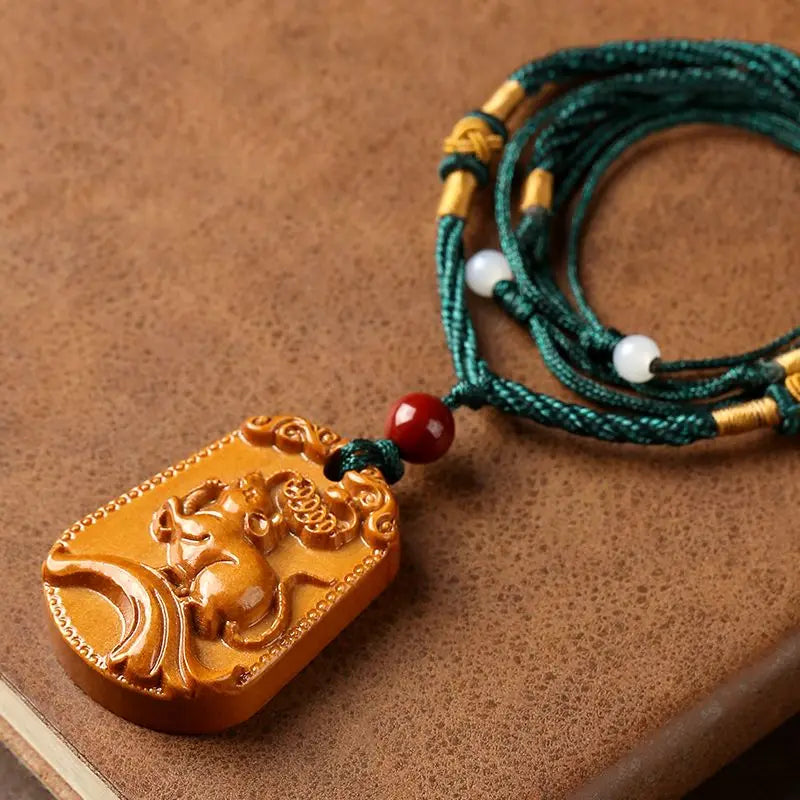 Peach wood zodiac carved pendant