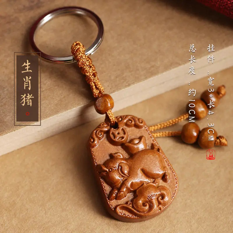 Peach wood zodiac carved pendant