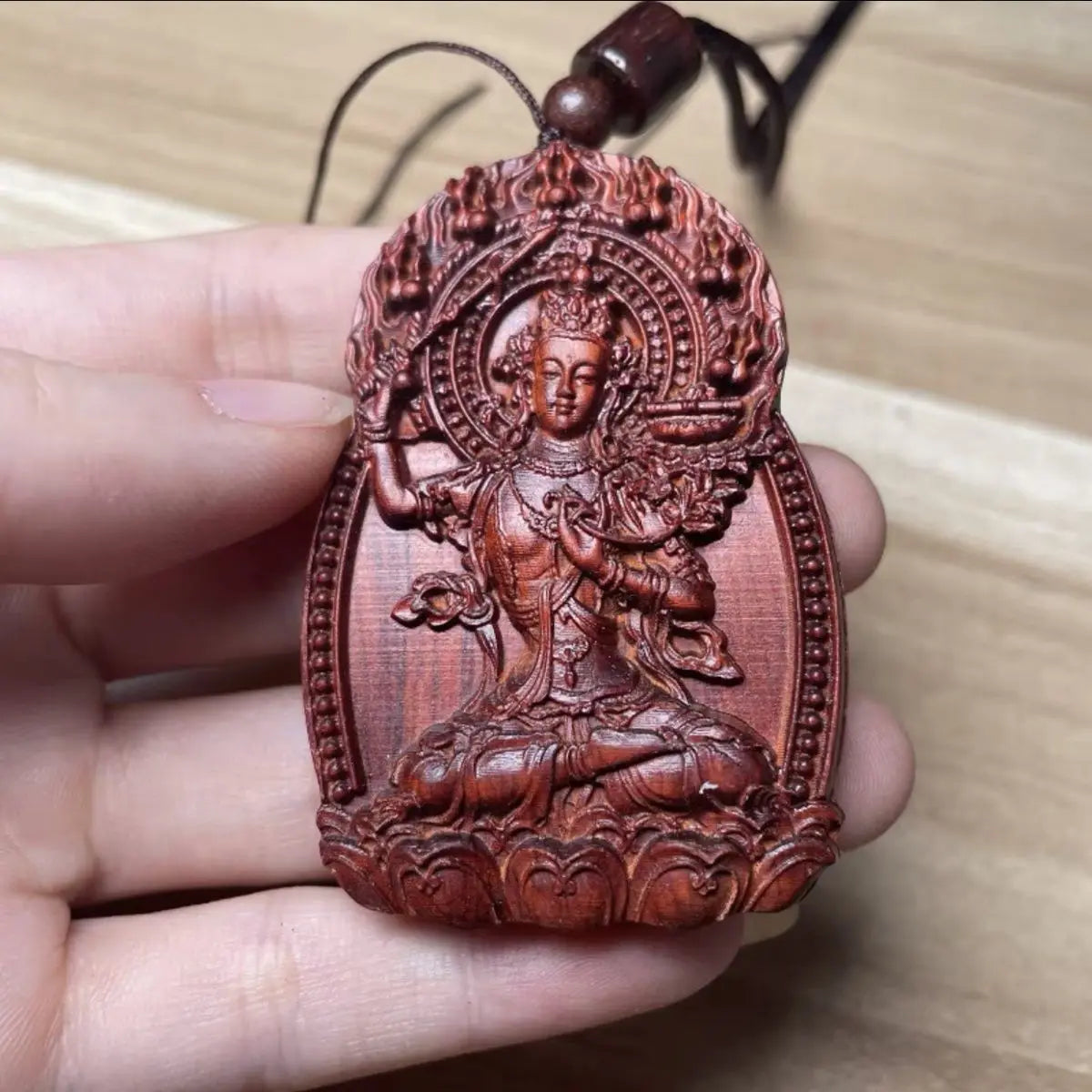 Rosewood Buddha amulet, carved with the twelve Chinese zodiac animals