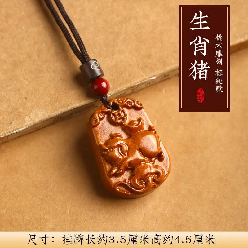 Peach wood zodiac carved pendant