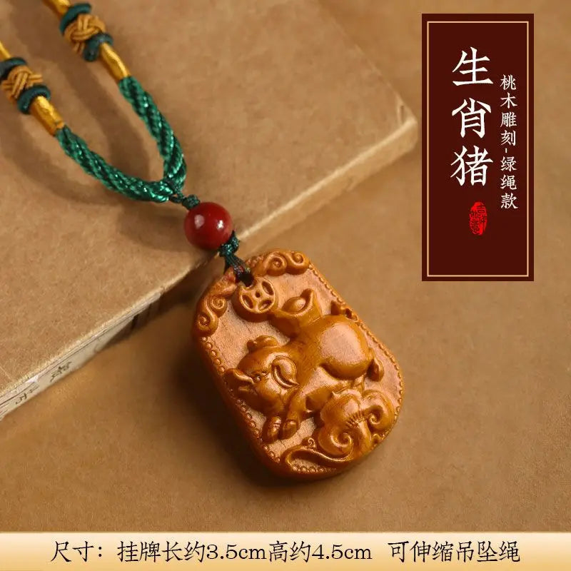 Peach wood zodiac carved pendant