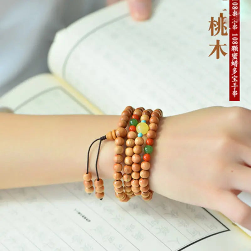 Peach wood multi-circle bracelet, beeswax lucky beads