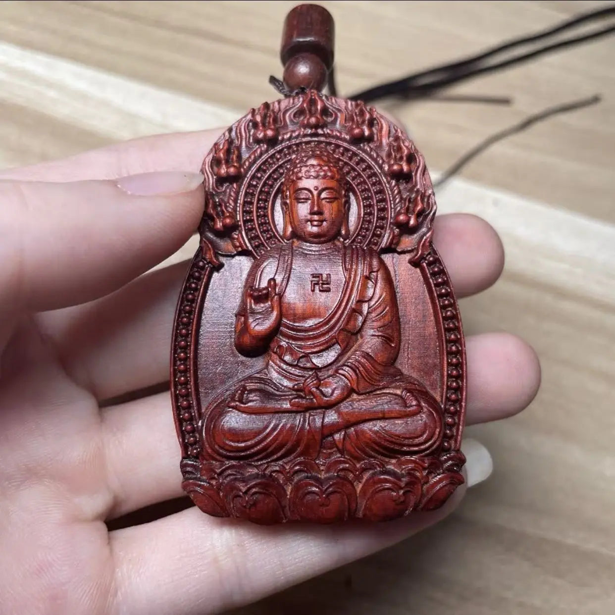 Rosewood Buddha amulet, carved with the twelve Chinese zodiac animals