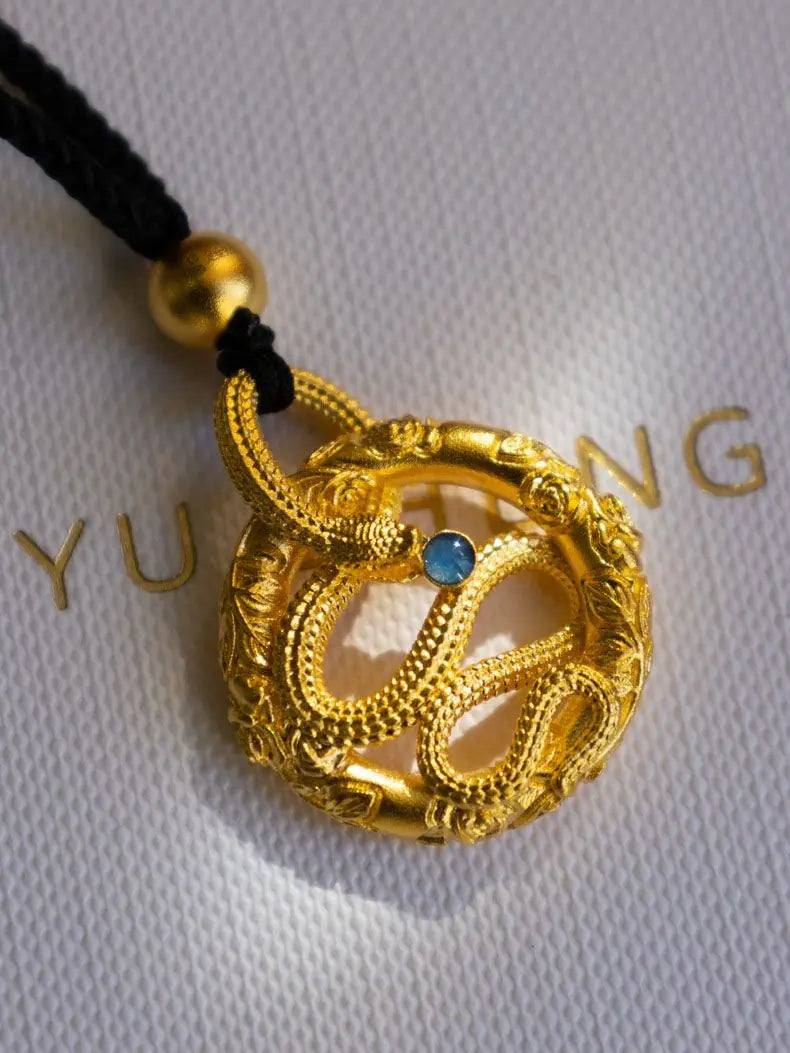 Golden snake round pendant