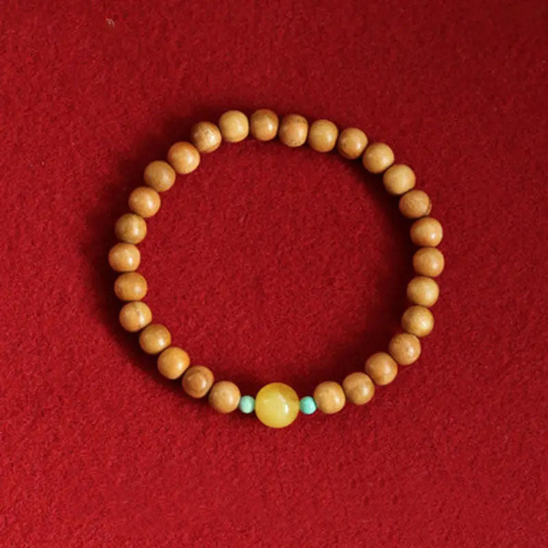 Peach wood multi-circle bracelet, beeswax lucky beads