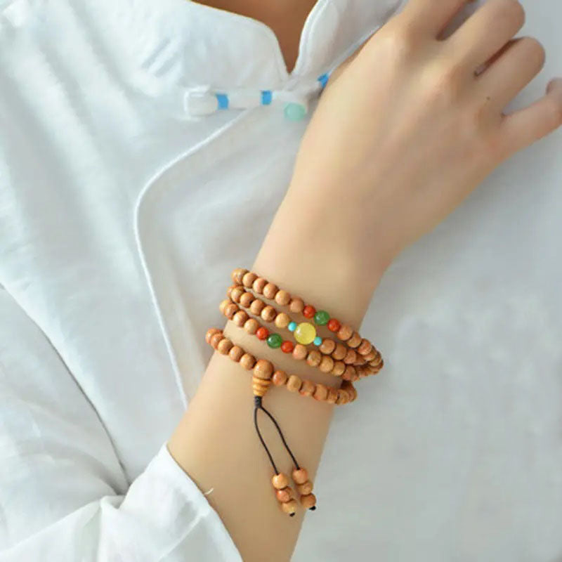 Peach wood multi-circle bracelet, beeswax lucky beads