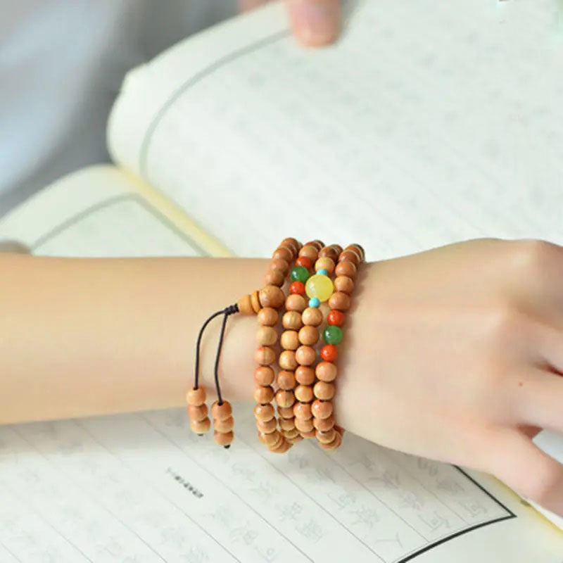 Peach wood multi-circle bracelet, beeswax lucky beads