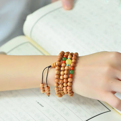 Peach wood multi-circle bracelet, beeswax lucky beads