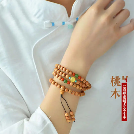 Peach wood multi-circle bracelet, beeswax lucky beads