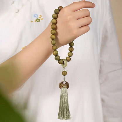 Green sandalwood bracelet with wooden beads and lotus pattern